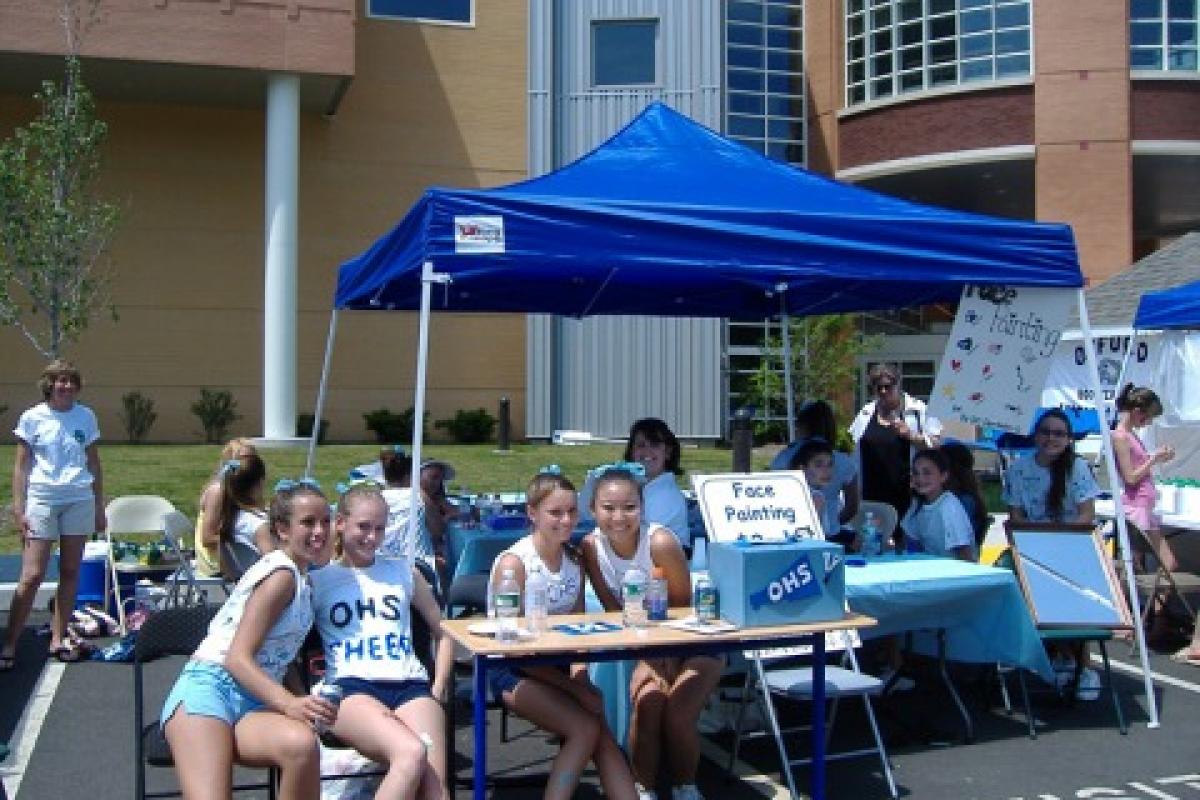 Oxford Day - June 2008 - the OHS Cheerleaders set up a face painting booth.
